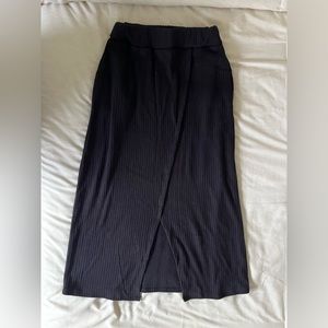 Woman’s black maxi skirt with slit. Size small.